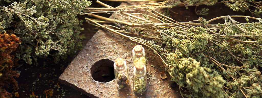 herbs, vials and cutting board